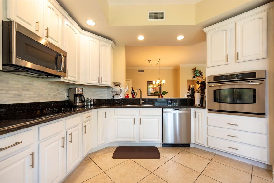 Water views all around. Stunning A model 2/2.5/Den with eat in kitchen in the most desirable Island House. Beautiful home with tons of upgrades, custom master closet. High impact windows & doors, large living area, spacious covered wrap around patio. Valet parking, Clubhouse, Fitness Center, Library,Resort style pool & spas, beauty salon, card room, full-service restaurant, Management & Medicare certified Home Health Care agency on site. Walkable to Publix, restaurants, minutes from Cleveland Clinic. Right to use storage available for purchase. $180/quarter restaurant credit, water, cable and internet included in maintenance. Furniture is negotiable. Must see!