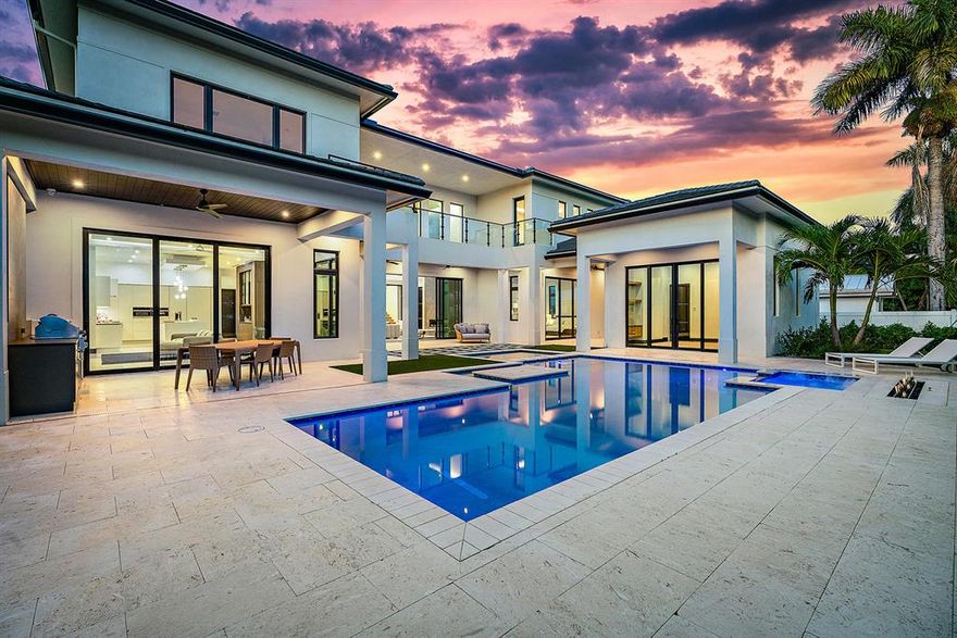 Live in Boca Raton's most sought-after neighborhood of Royal Palm just moments from the beach & across from Boca Raton Resort & Club. Enjoy the Florida lifestyle & entertain outdoors with a full summer kitchen, covered porches, fireplace, heated salt water pool with built in table & spa.The chef's kitchen features all MIELE appliances, top-of-the-line cabinetry, walk-in pantry, large island with an open family & dining area. First floor master suite has his/hers closets with a large private patio & fireplace. Take the elevator to the second floor where the open concept continues with bright views, glass railings, floor to ceiling windows & balconies. MUST See detached guest house has a walk-in closet, bathroom and it's own private porch. Fully automated smart home.