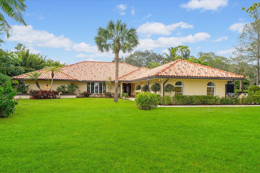 Welcome to this exceptional residence in Paddock Park 1 with No HOA on 1.12 acres and ample room for your Boat and RV. This 4-bed, 4-bath home features a newer custom barrel tile roof and 3829 sqft, a large primary suite and triple split bedroom floorplan. The recently refinished 36x18 heated pool/spa and spacious screened patio form an outdoor oasis complete with cabana bath.  The kitchen includes new granite countertops, double ovens, wine fridge, walk-in pantry, custom double copper sink and hood, large island with 360' storage, a dine-in area framed by French doors overlooking the pool. Family room features vaulted oak beam ceiling and Fieldstone fireplace. Security cameras in use. Utility has granite counters, GE fridge/freezer, new Samsung washer/dryer. Newer hot water heaters. Accordion panel shutters, seamless gutters, water filtration, softener and interior is freshly painted. Walk or Golf Cart to A rated schools and minutes to WEF. Schedule a viewing today, your dream home awaits.