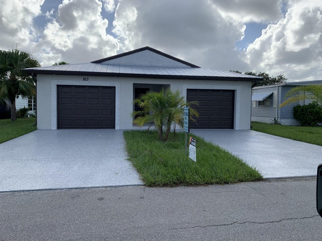 Photo of 163 Camino Del Rio, Port Saint Lucie, FL 34952 (MLS # R11126395)