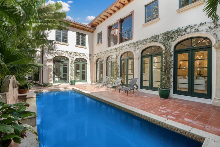 Beautiful Mediterranean townhouse impeccably maintained and located on desirable in-town street - close to Worth Avenue and the beach. 3BR/5.1BA with 4th bedroom or family room on first floor. Elevator, gas fireplace, heated pool and exercise room. Move right in and enjoy this wonderful townhouse.