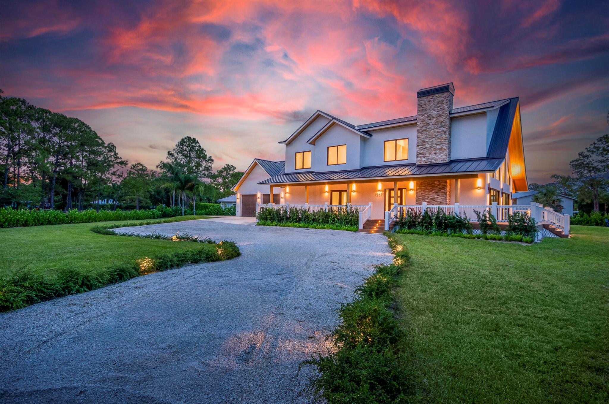 Welcome to a stunning fusion of modern luxury and farmhouse charm, nestled in the heart of Jupiter Farms. Designed by award-winning Wandrian Studios, this brand-new, two-story concrete block estate redefines Florida living with elevated design, high-end finishes, and a seamless indoor-outdoor lifestyle--all set on a fully irrigated 1.31-acre lot with no HOA.Step inside 3,600+ square feet of thoughtfully crafted space featuring five spacious bedrooms, four full bathrooms, and a versatile loft. Monolithic Bellevue porcelain tile flows throughout the home, creating a sleek, cohesive backdrop to the Italian-inspired chef's kitchen with premium Bosch appliances. The centerpiece living room is anchored by a breathtaking two-story A-frame window, flooding the interior with natural light