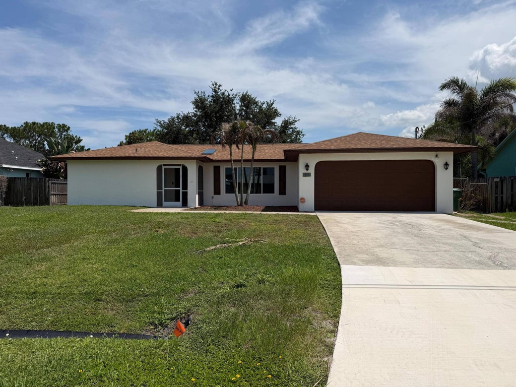 Photo of 450 SW Eyerly Avenue, Port Saint Lucie, FL 34983 (MLS # B26043965)