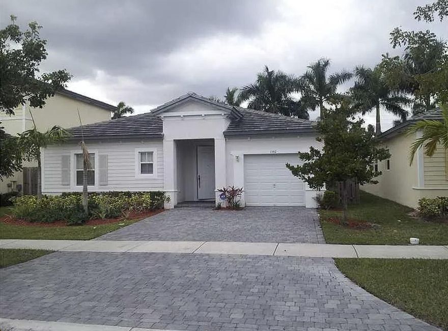 Discover this spacious 3-bedroom, 3-bathroom single-family home in a desirable gated community in Homestead, Florida. With 1,889 sq ft of living space all on one level, this home features a formal dining room, generous living area, and a dedicated laundry room. Enjoy peaceful canal views from your private backyard. The home also includes an attached garage and access to community amenities such as a pool, exercise room, and low HOA fees. A perfect blend of comfort, convenience, and lifestyle.