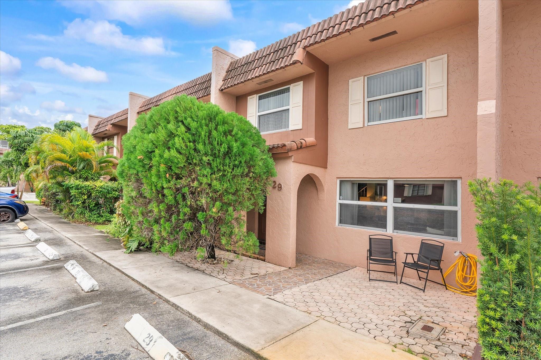 This spacious two-story townhome in Valencia Village offers 3 bedrooms and 2.5 baths across 1,590 sq ft of comfortable living space. Ideally located just across the street from multiple universities, offering unmatched convenience. The open layout feels bright and inviting, ideal for both everyday living and entertaining. Enjoy a screened patio perfect for outdoor dining, plus a balcony off the primary suite. A new HVAC system, installed in December 2023, adds comfort and efficiency. Laundry is conveniently located on the patio, with two assigned spaces and ample guest parking. The community backs to green space and is quiet and welcoming. Ideally located near I-595, universities, shopping, dining, and top schools, this home strikes the perfect balance of location and livability.