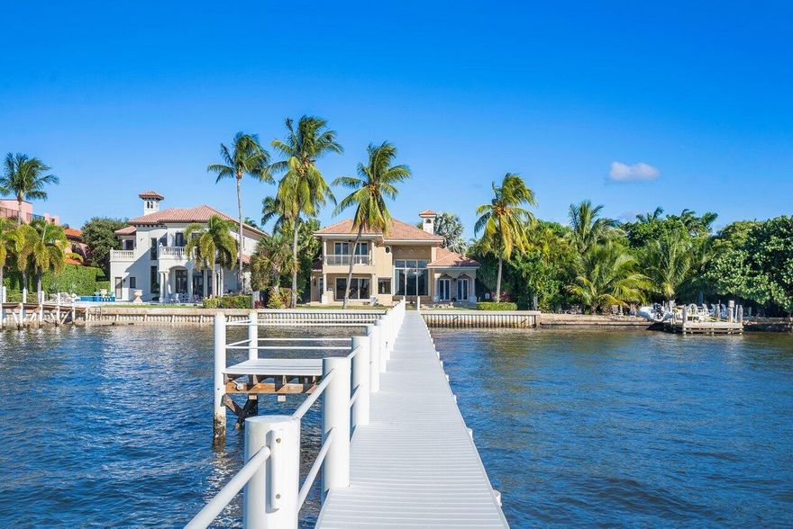 DIRECT WATERFRONT W/PRIVATE DOCK & LIFT- Ocean access & wide water views. 5-bedroom home nestled on a private street in excellent proximity to Palm Beach Island. Close to beach, restaurants, shops, 5-Star hotel spa & tennis courts available to the public. 26,000 lbs. boat lift complete with water & electric, 3-car garage, large loggia w/summer kitchen and balcony for outdoor relaxation & entertainment, phenomenal views, heigh ceilings & doors throughout, first floor large VIP suite.