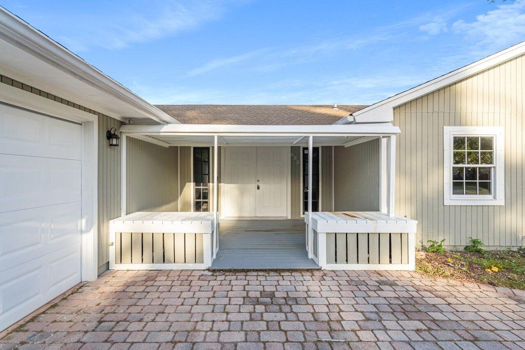 Photo of 633 NE Larkspur Lane, Port Saint Lucie, FL 34953 (MLS # R10938797)