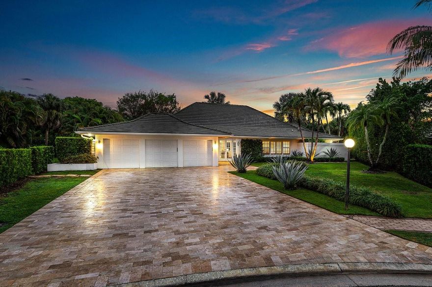 Tucked away on a quiet cul-de-sac in the prestigious St. Andrews Country Club, this beautifully updated one-story residence offers refined indoor-outdoor living with timeless charm. Vaulted ceilings and a wood-burning fireplace anchor the spacious main living area, creating warmth and character rarely found in modern renovations.  The interior of the home is drenched with natural light throughout, complete with impact windows and doors. The split floor plan includes four generous bedrooms, four full bathrooms, and a dedicated office, plus two main living areas for entertaining. The primary suite opens directly to a serene patio retreat—perfect for morning coffee or evening wind-downs.