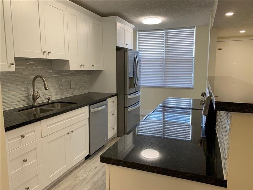 Photo of 250 Jacaranda Drive #203, Plantation, FL 33324 (MLS # F10446262)