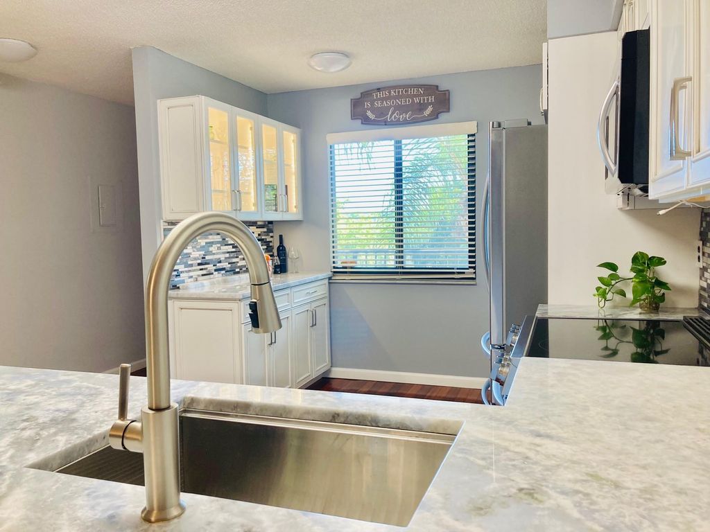 Photo of 2112 S Cypress Bend Drive #306, Pompano Beach, FL 33069 (MLS # F10404813)