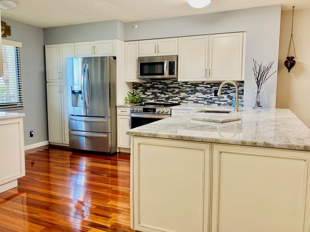Photo of 2112 S Cypress Bend Drive #306, Pompano Beach, FL 33069 (MLS # F10404813)