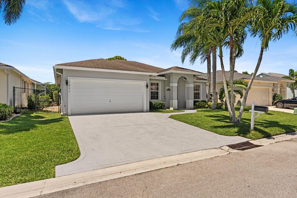 Photo of 1209 Olympic Circle, Greenacres, FL 33413 (MLS # R11100595)