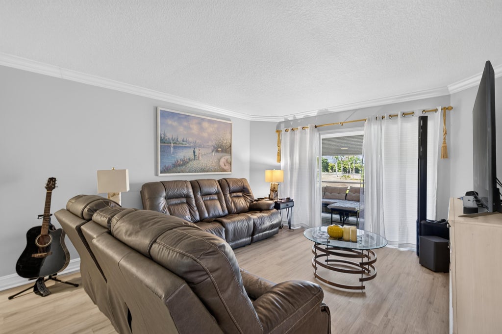 Photo of 3871 VIA POINCIANA #202, Lake Worth, FL 33467 (MLS # B26092723)