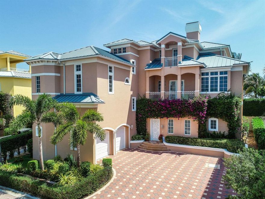 A truly unique beachfront offering in the seaside, gated community of Jupiter Key! Enjoy the sparkling Atlantic Ocean views and continuous breeze from multiple balconies and vantage points. This completely customized home features a private backyard oasis that is perfect for outdoor entertaining. A large pool and spa deliver a resort-style feel, while the extended loggia and outdoor fireplace offer plenty of areas for lounging or dining. A rare-find, this home has both a main house and a guest house allowing for optimal privacy and convenience. The main residence features an open gourmet kitchen, formal dining room, large master suite, guest suite and a private elevator. The grand family room has a built in bar,  an office and multiple balconies to enjoy the views.