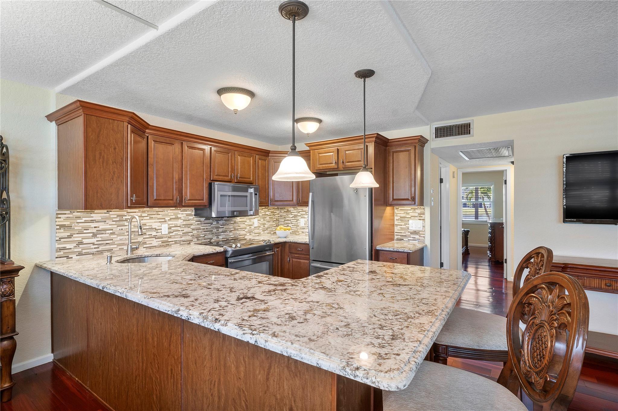 Fully Furnished condo located in the heart of Boca Raton! HOA Approval required. First floor- Open layout concept, engaging Living room and dining room, perfect for entertaining! Kitchen and bathrooms have top of the line Imported Italian granite and cabinetry. Brazilian cherry floors throughout with State-of-the-art spacious bathrooms. Stunning Primary bedroom with Flat screen TV. Guest bedroom with walk-in California closet...Leading out to screened in patio through elegant double French doors with built In blinds. This gorgeous patio has custom furniture that can accommodate a large group! Amazing panoramic water views to relax and enjoy. Conveniently located near shopping, highways, transportation, restaurants, beaches, etc. Assigned parking. Gated community. Make an appointment today!