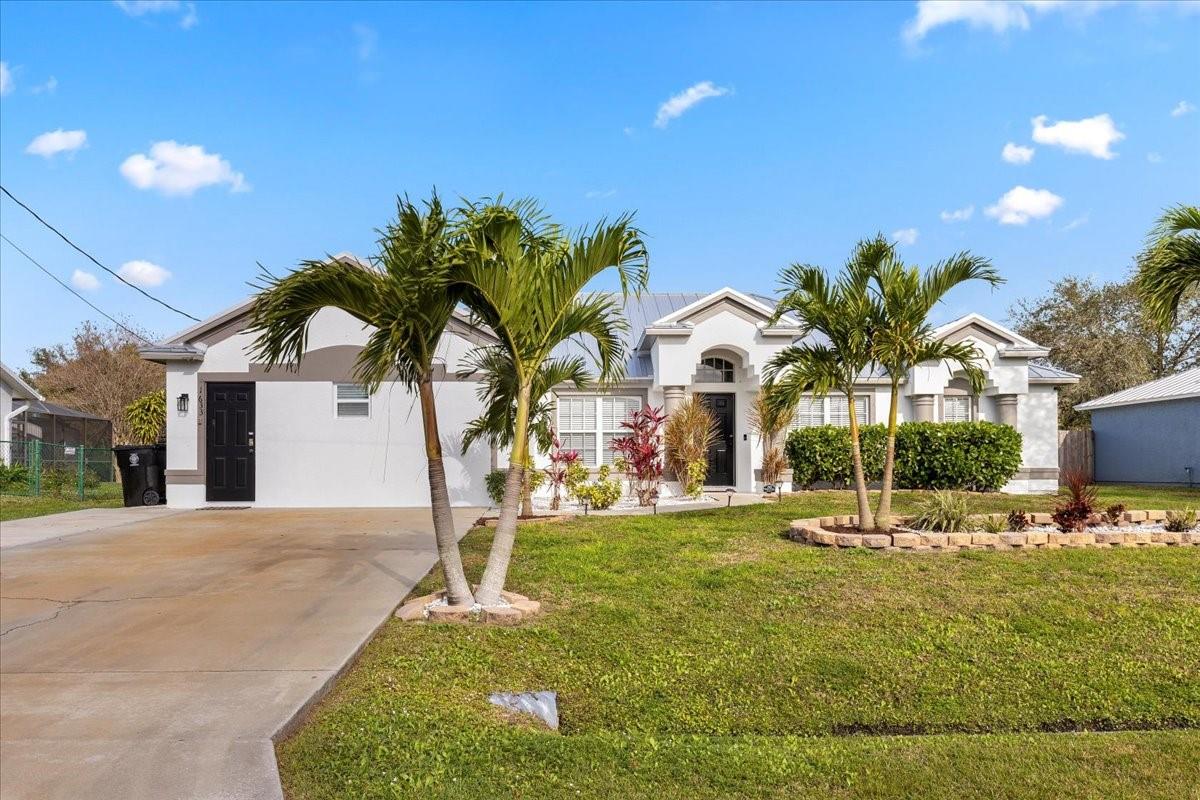 3 Bed/2 Bath home boasting 2386 sqft under air. Tile floors throughout the residence, with new tile floors in the main living area. Upgraded kitchen in 2023, with stainless steel appliances, Quartz countertops, and an aesthetic that blends functionality with style. Updated bathrooms, a complete laundry set, and a screened patio overlooking a vinyl-fenced backyard, featuring a hot tub, fire pit, and a useful shed. Garage was converted to an In-law suite with separate entrance, installed in 2020, and equipped with an instant hot water tank, makes this property not only a delightful home but also an income-producing gem, with an average of $20k annually over the past three years. A new metal roof in 2023 ensures durability and adds to the overall appeal of this exceptional residence.