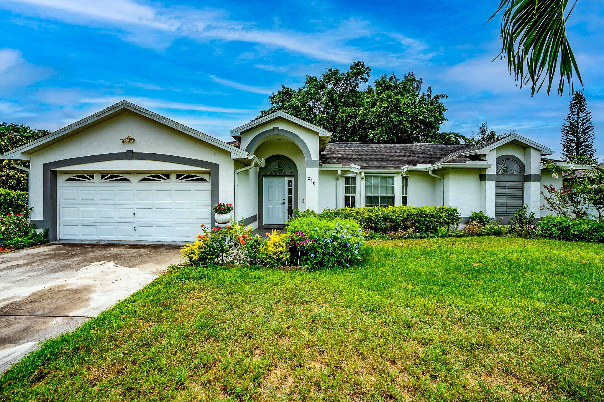 Available to see starting 8/23/25 A charming 3-bed, 2-bath home nestled in the heart of Port St. Lucie. Built in 1997, this spacious 1,654 sq ft residence features vaulted ceilings, tile flooring throughout, and a split-bedroom layout for added privacy. The kitchen boasts a brand-new stove and microwave, while the interior was freshly repainted in January. Enjoy peace of mind with a roof installed in 2018 and a newer AC from 2019. Step outside to a generous screened patio perfect for entertaining, plus a fenced backyard with a storage shed. Centrally located near all amenities, this home blends comfort, style, and convenience. Dryer does not convey. Home is occupied. Appointments only.