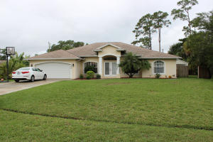 The perfect home for the active family! Large 4 bedroom home, with 3 full bathrooms, with a functioning two car garage that is air conditioned! Garage can also serve as a hobby/game room or office. New A/C installed in 2011. New sprinkler system installed in 2105. 80 gallon hot water heater is solar heated. Screened solar heated pool is 26 X 13. Large 24 X 12 shed is also on property. Home has an abundance of windows that look out onto the pool area and a private backyard. Master has French doors that open to patio. Large kitchen with stainless steel appliances. This is one of those homes that you have to walk through to appreciate. It is spacious with a split floor plan. The oversized lot, combined with the large screened pool makes this a great home for children.