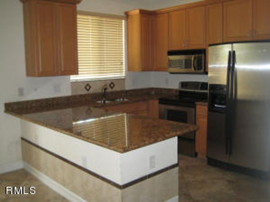 Charming 2 story townhome with ample backyard that is fully fenced!!  Close to beach and Boynton Beach's Harbor Marina district