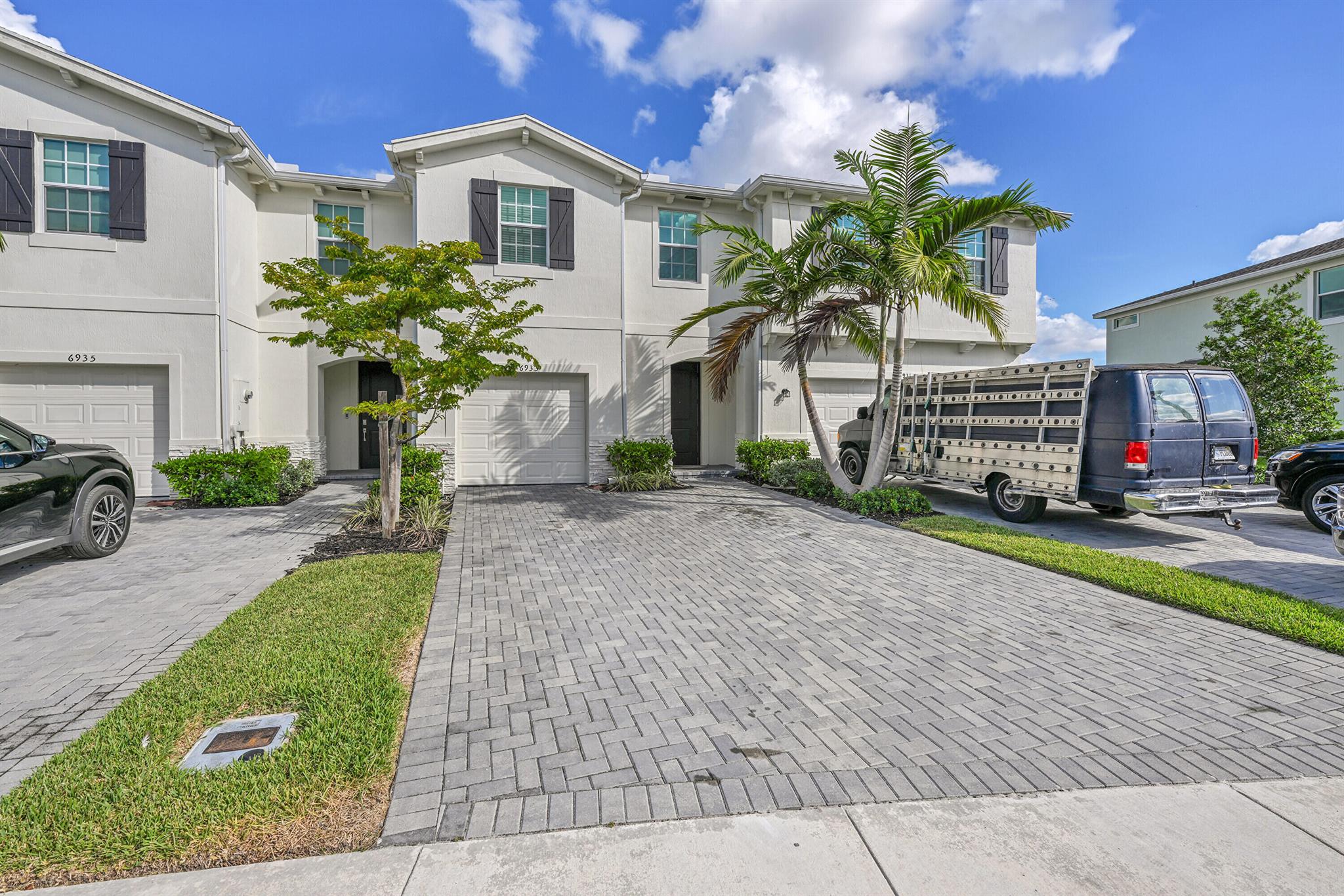 Beautiful 4-bedroom, 2.5-bath townhouse in Lake Worth offering modern comfort and low-maintenance living. Features an open floor plan, stainless steel kitchen appliances, smart locks, Ring camera, and attached garage. Enjoy a peaceful patio with water views in a gated community with 24-hour security and pool. Just 5 minutes from Florida's Turnpike, close to shops and dining. High-speed internet included; tenants pay water and electricity.