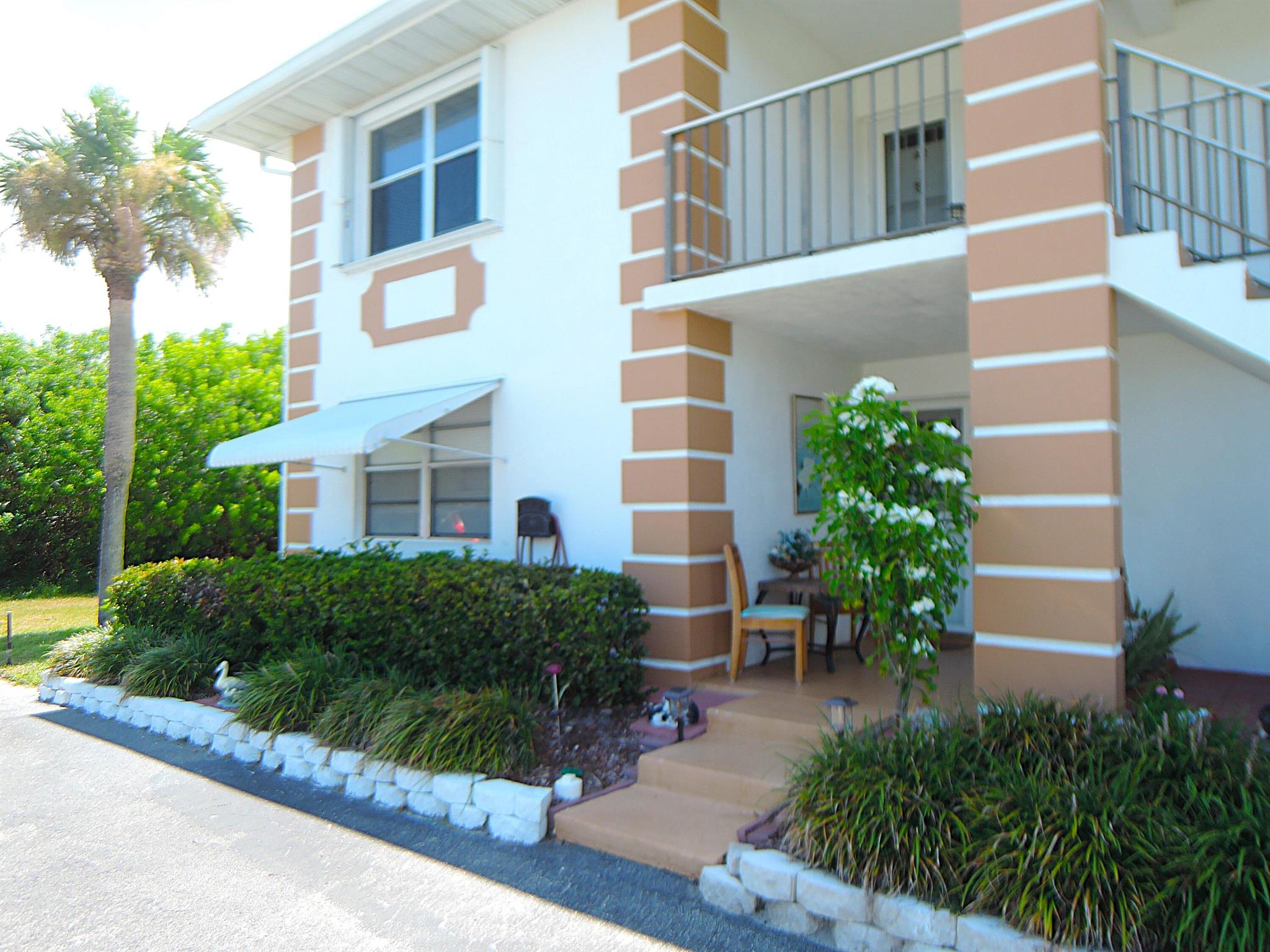 Quiet Cul-de-sac setting is this 1st floor corner condo, w/private side yard & canal in back. Unique interior finishes will amaze you as you enter the foyer, w/tiled entry, impressive wood trim everywhere + crown molding. 2025 new AC system. Tiled floors throughout. Kitchen features wood cabinets, few SS appliances, full size stack front loader W/D. Extra cabinet + counter space allows additional storage & prep areas. Master bedroom features desk area, ceiling fan + updated bath w/vanity, tiled shower & organized walk-in closet. Like to entertain than you'll enjoy the fine finishes to this FL RM, more insulation on the ceiling & walls, sit-at bar w/built-ins behind & in closet area. Leaving slider open allows the AC to cool this area. An open patio to grill out in this quiet setting.