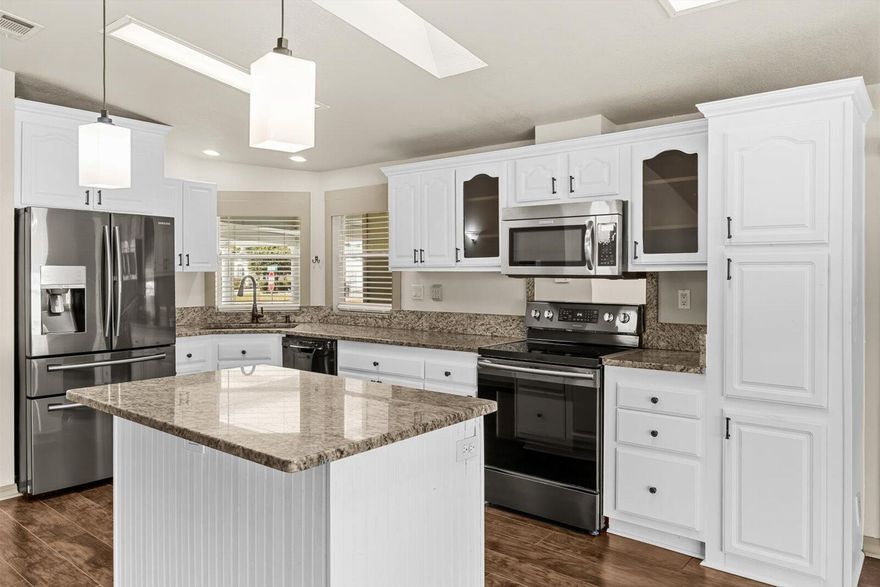 Don't miss this great offer.  2005 Model. New roof in 2021. New A/C. Upgraded large supply and return duct work. New gutters. New washer and dryer. New faucets. new well pump for irrigation system. Granite counter tops throughout. This home is a real must see. Open floor plan. Corner lot.  Oversized shed for toys & Golf cart storage. Almost 1500 sf of living space. Screened in Lanai. The kitchen is a chef dream. lots of counter space and ample storage. This is a active 55 and older communities with all the amenities Golf, Tennis, Pickleball, shuffleboard, Horseshoes. Three beautiful Clubhouses all with exercise rooms, Heated pools, Rv & Boat storage on site. 
This is a Land Leased property
CABLE TV, INTERNET, GARBARGE, & AMMENTIES INCLUDED