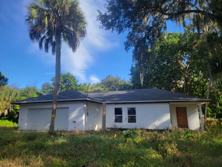 CBS Built, over 2,400 under future air conditioned space total of 2,854 or more under roof.  New Roof, New Trusses, New waterlines and plumbing.  This 4 bedroom, 2 bath, 2 car garage home sits on a canal at rear of property.  Lots of overgrowth currently.  Looks to be about 80 feet on canal. Beautiful old Florida charm with an oak tree Spanish moss hanging, tree is huge may have been here since Ponce -DeLeon discovered Florida, truly magnificent to see. Quiet unassuming neighborhood.  Extra space on left and right of home, no direct back yard neighbors due to canal.  No neighbors on left side dead end street.  This is a short sale at $198,900.  To purchase outright as a 203k or other refi with repairs $243,000.  Home value at $410,000 or more depending on interior upgrades when made.