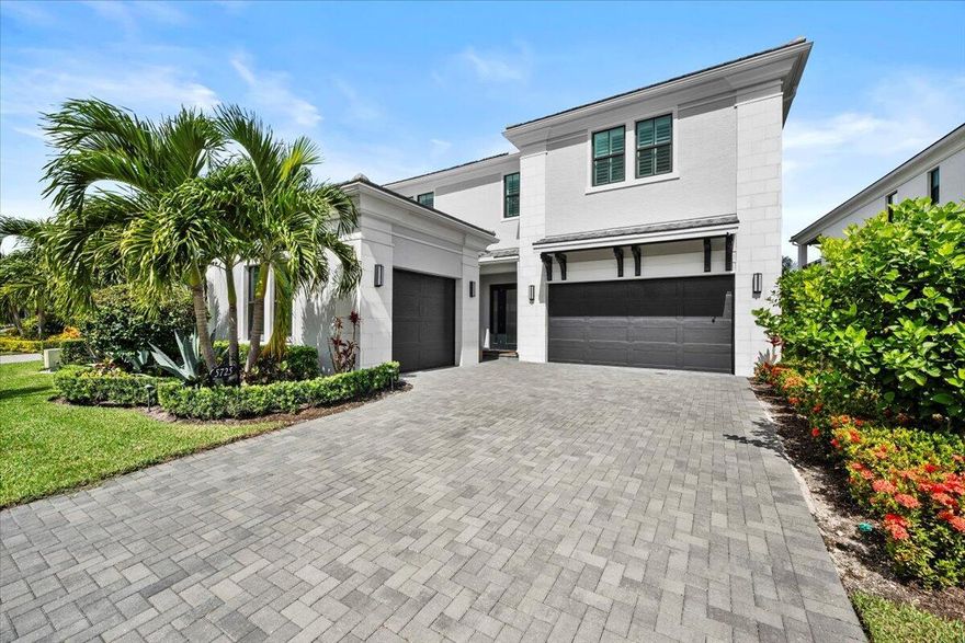 Highly upgraded Mondrian model with an oversized pool, impressive lake views and a custom outdoor kitchen and covered entertainment area with drop down screens. The master bedroom and den are conveniently located on the first level of this home with two guest suites and a huge loft upstairs. The oversized 3 car garages include the extra square footage option that allows room for 3 vehicles plus plenty of storage. Real wood flooring adds visual warmth to the master suite where you wake up overlooking the pool and lake. Located in the center of the community as well as the center of the lake, this backyard features the best views Artistry has to offer. Finishing touches include plantation shutters, light fixtures, high end built in master closet and a heated pool and spa.