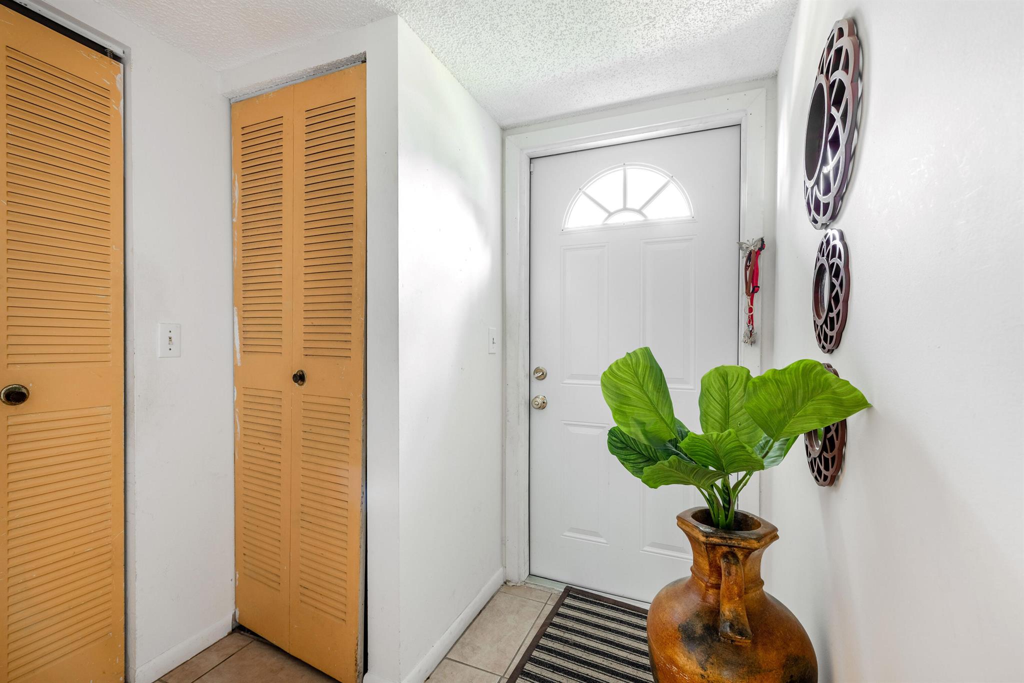 Welcome to this spacious and well-maintained 1-bedroom, 1.5-bath first-floor condominium, offering both comfort and practicality. Enjoy the ease of ground-level living and relax on your private screened porch with peaceful waterfront view, The generous primary suite features a large walk-in closet and a private en-suite bathroom. While the unit is move-in ready, there's potential to add your personal touch with a few updates. Recently completed exterior painting and newly installed screened enclosures for all units. Conveniently located and competitively priced, this property is ideal for a buyer looking for value and serenity. Motivated seller--bring your offers!