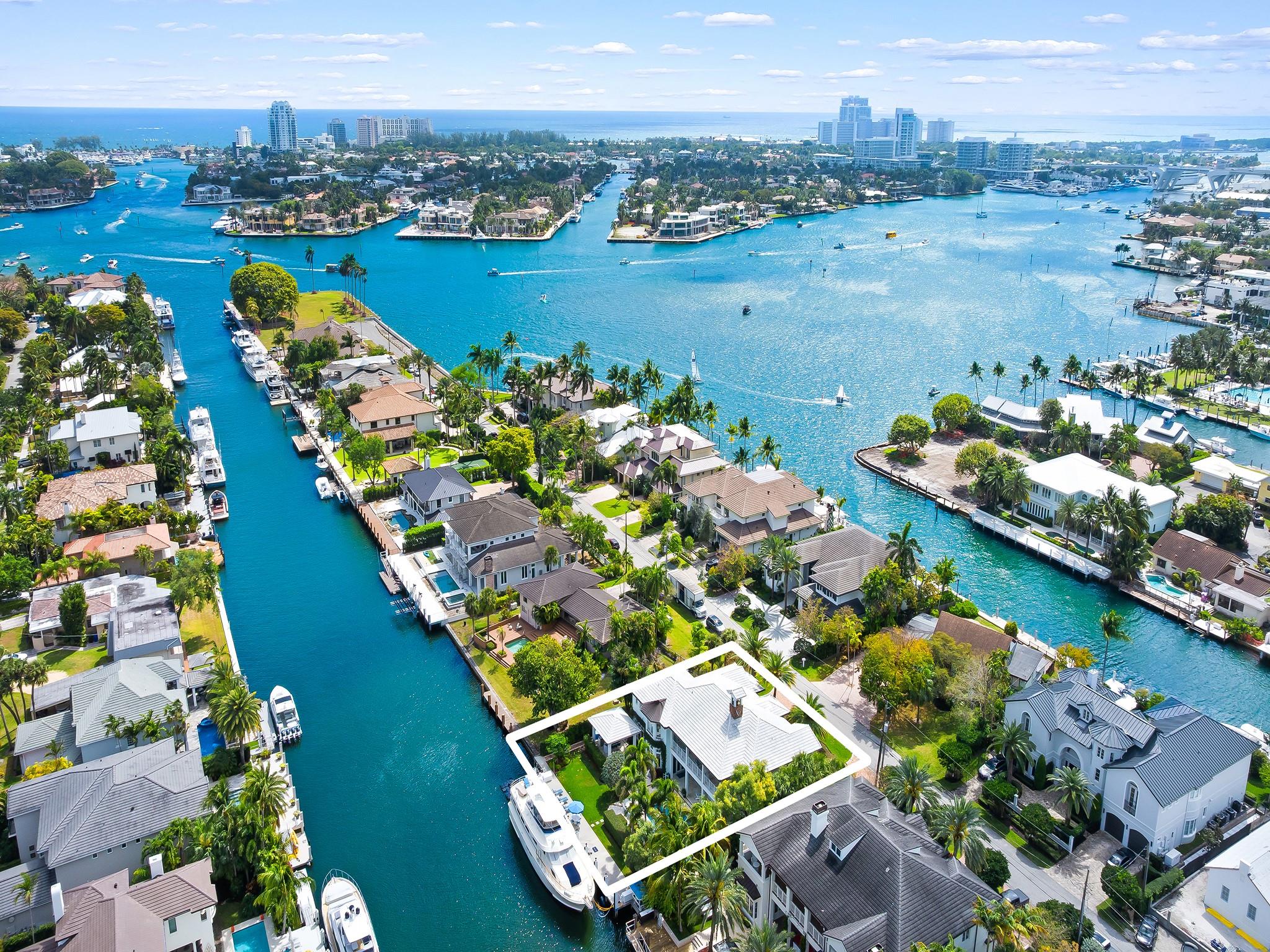 Ft. Lauderdale's most coveted neighborhood-RIO VISTA! This stunning waterfront estate boasts 109' of water frontage, a sprawling backyard with lush green space, an outdoor gazebo, a cozy fire pit, and a cabana bath w/steam shower. An elegant living room with a fireplace and breathtaking views of the backyard oasis. The impressive chef's kitchen is a culinary dream, featuring Thermador and Sub-Zero appliances, a spacious dining area, and additional countertop seating. Hand-carved wood floors flow throughout the home, your floor plan includes a dining room, butler's pantry, offices, living room, and two dens. Upstairs: wide hallway leads to five generously sized bedrooms, 2 front patios, and a large waterside veranda. Built w/impact windows and doors. Elevator is located by the stairs.