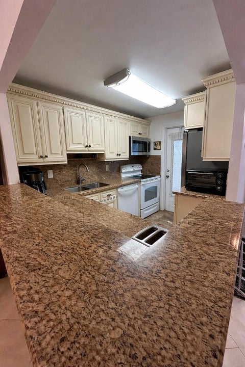 Photo of 400 SE 10th Street #202, Deerfield Beach, FL 33441 (MLS # B26010994)