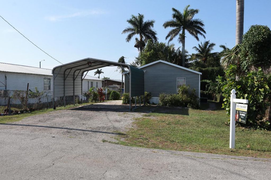 Photo of 817 E 7th Street, Pahokee, FL 33476 (MLS # R11090055)