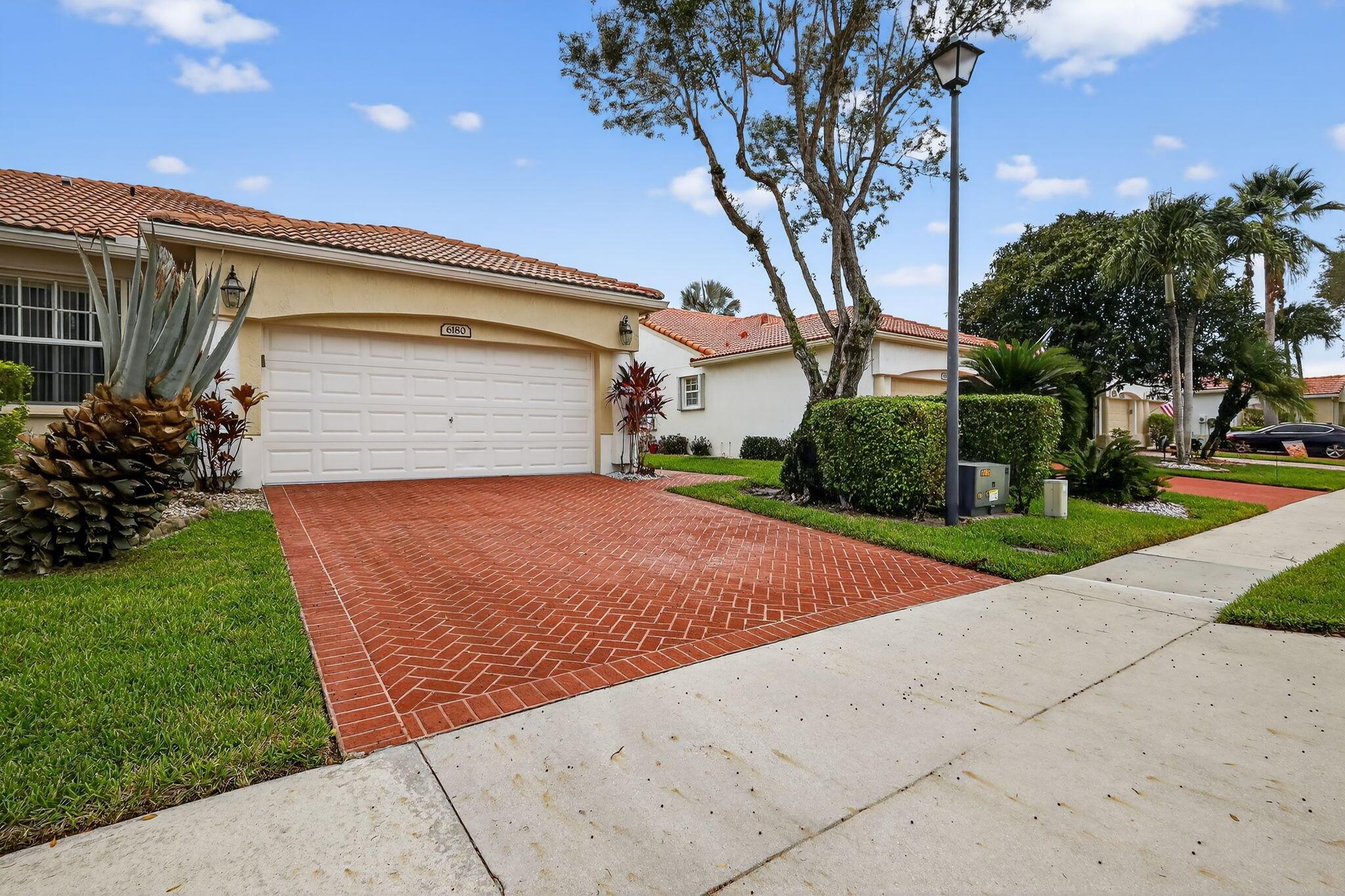 Move in condition and renovated 2 bedroom, 2 bath, 2 car garage, with a formal dining room and den/office. All bedrooms with new luxury vinyl plank flooring. Upgraded kitchen with granite counters, newer stainless steel fridge, oven and microwave. Kitchen faucet and cabinet pulls replaced with contemporary black finished hardware. Upgraded floor tiles throughout the main living area enhance the luxury of this home. Floral Lakes is one of the best value communities of this type in the Palm Beaches and Delray Beach. Located near shopping, entertainment in a well run community clubhouse. Tropical beaches and fine dining opportunities moments away in cosmopolitan Delray Beach within a short travel time. A must see opportunity for a move in ready Delray Beach villa home.