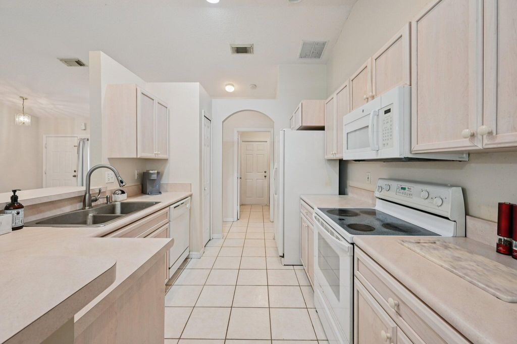 Photo of 5920 NW Wolverine Road, Port Saint Lucie, FL 34986 (MLS # R11168439)