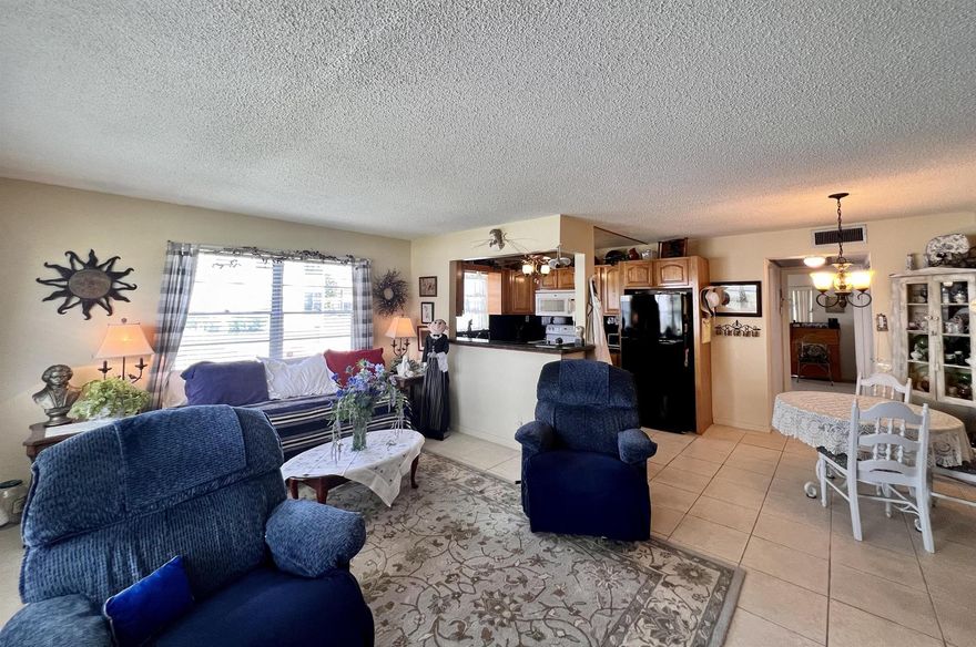 You Will Feel Right At Home In this FIRST FLOOR CORNER 1/1.5 in 55+ Century Village! Lovely Open & Updated Kitchen Thoughtfully Designed With Extra Cabinets and Granite Counters. Central AC. Neutral Tile Flooring Flows Throughout The Condo. Updated Baths. Large Bedroom Suite With Access to the Lanai, Wall of Closets, and a Full Updated Ensuite Bath With Low Threshold Step-in Shower. Sold AS IS & Furnished As Shown. Fantastic Location Close to the Camden Pool and the Hastings Pool. Century Village is a 55+ community with so much to offer... shows, movies, clubs, pools, security, and transportation service. The Clubhouse features a theater, indoor pool, card room, community/party room, billiard room, shuffleboard, tennis, pickleball, bocce, and two outdoor pools. Numerous heated outdoor pools throughout the community. Separate fitness center with gym and outdoor heated pool & resistance pool. Two guarded gates and 24-hour roving security patrol.