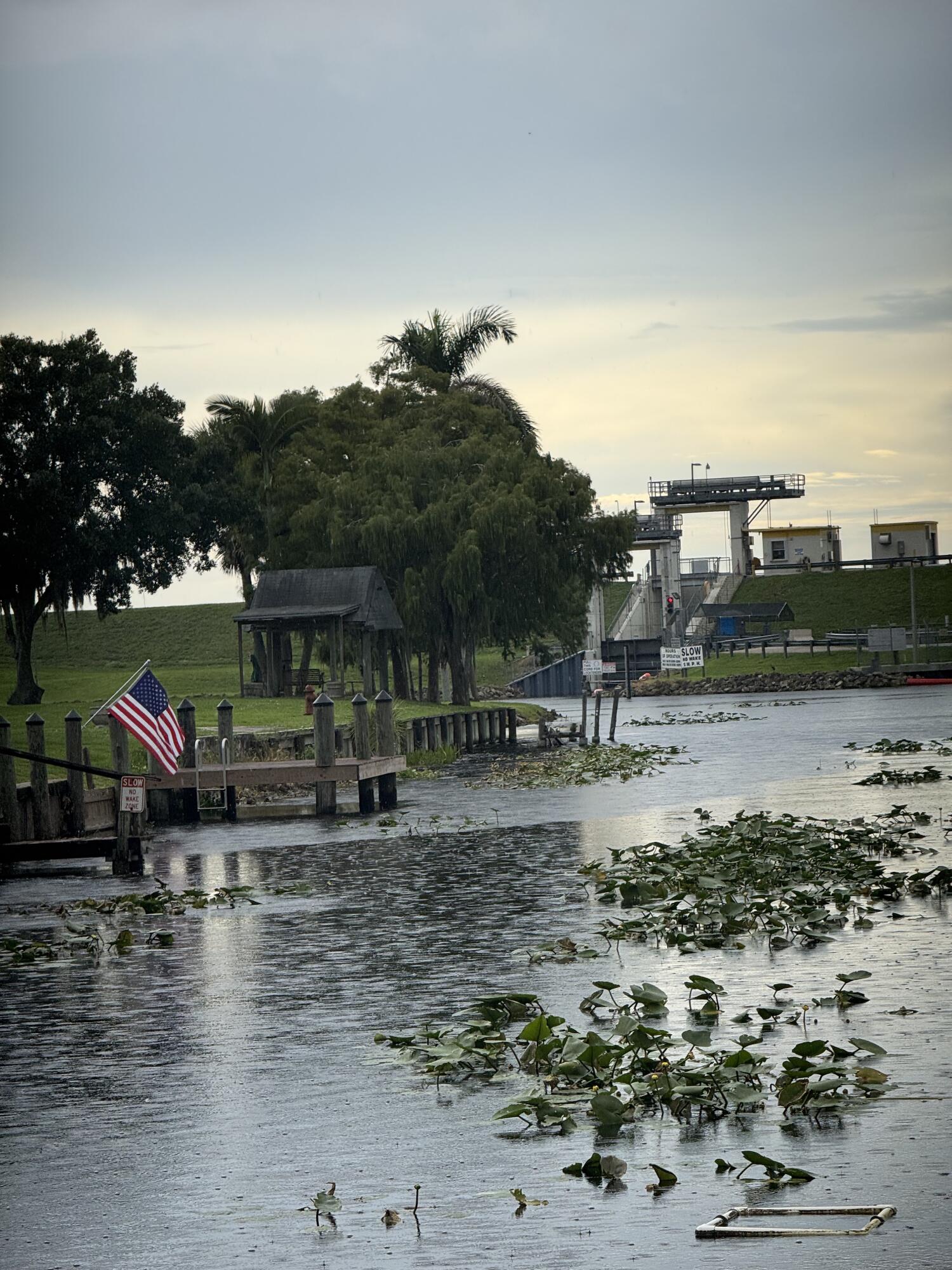 Fantastic Waterfront Opportunity! Canal front and minutes to lock and lake this 2/1 with garage and additional storage building allows for EZ living. Vaulted ceilings, wood burning fireplace, New Bathroom Shower, large primary walk in closet, laundry room and water views! Wake up to brilliant views of water fowl and excellent bass fishing with local tournaments along the rim canal. Bike the rim, fish and then take your golf cart to J&S for a drink, a bite and live music weekends. There's really nothing that compares to this gem!