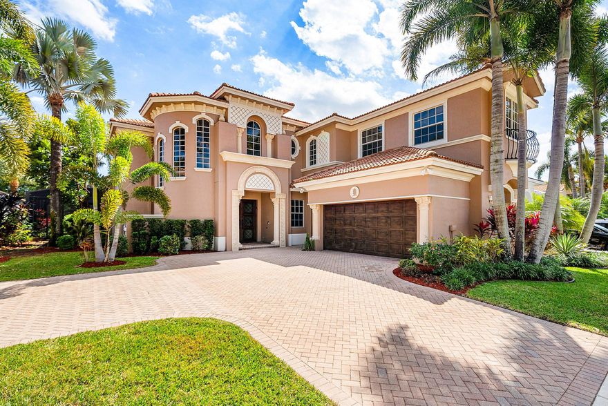 Elegant Mediterranean estate in the highly sought-after Mizner Country Club, This beautiful two-story home features 4 bedrooms, 5 full baths, and stunning golf course views. The spacious layout offers soaring ceilings, abundant natural light, and an upstairs loft overlooking the main living area. Designed for indoor-outdoor living, the private backyard showcases a resort-style freeform pool with a dramatic double rock waterfall and generous patio space perfect for entertaining.

Home has two new AC units installed (2025)

Located within a 24-hour guard-gated community, Mizner Country Club offers an exceptional lifestyle with a luxury clubhouse, resort-style pool, state-of-the-art fitness center, tennis and pickleball courts, multiple dining venues, and a full calendar of social activit
