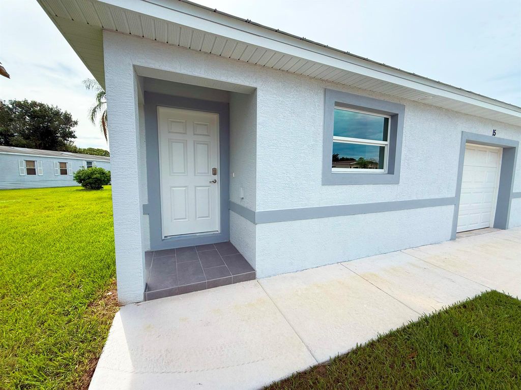 Photo of 15 Jacaranda Lane, Port Saint Lucie, FL 34952 (MLS # R11118966)