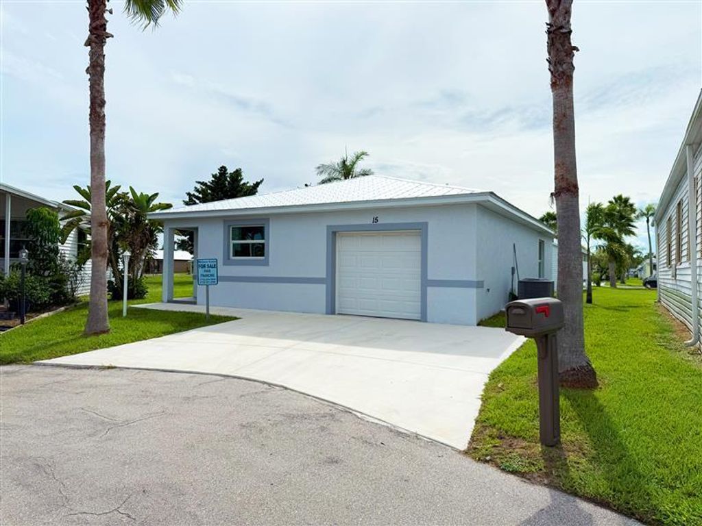 Photo of 15 Jacaranda Lane, Port Saint Lucie, FL 34952 (MLS # R11118966)