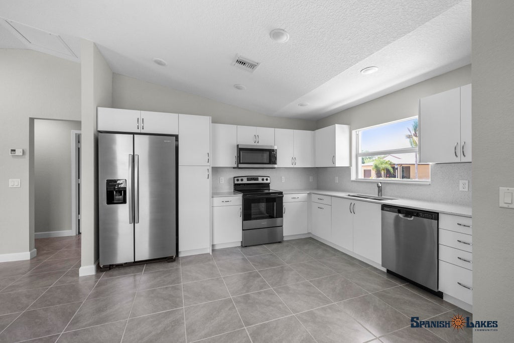Photo of 15 Jacaranda Lane, Port Saint Lucie, FL 34952 (MLS # R11118966)