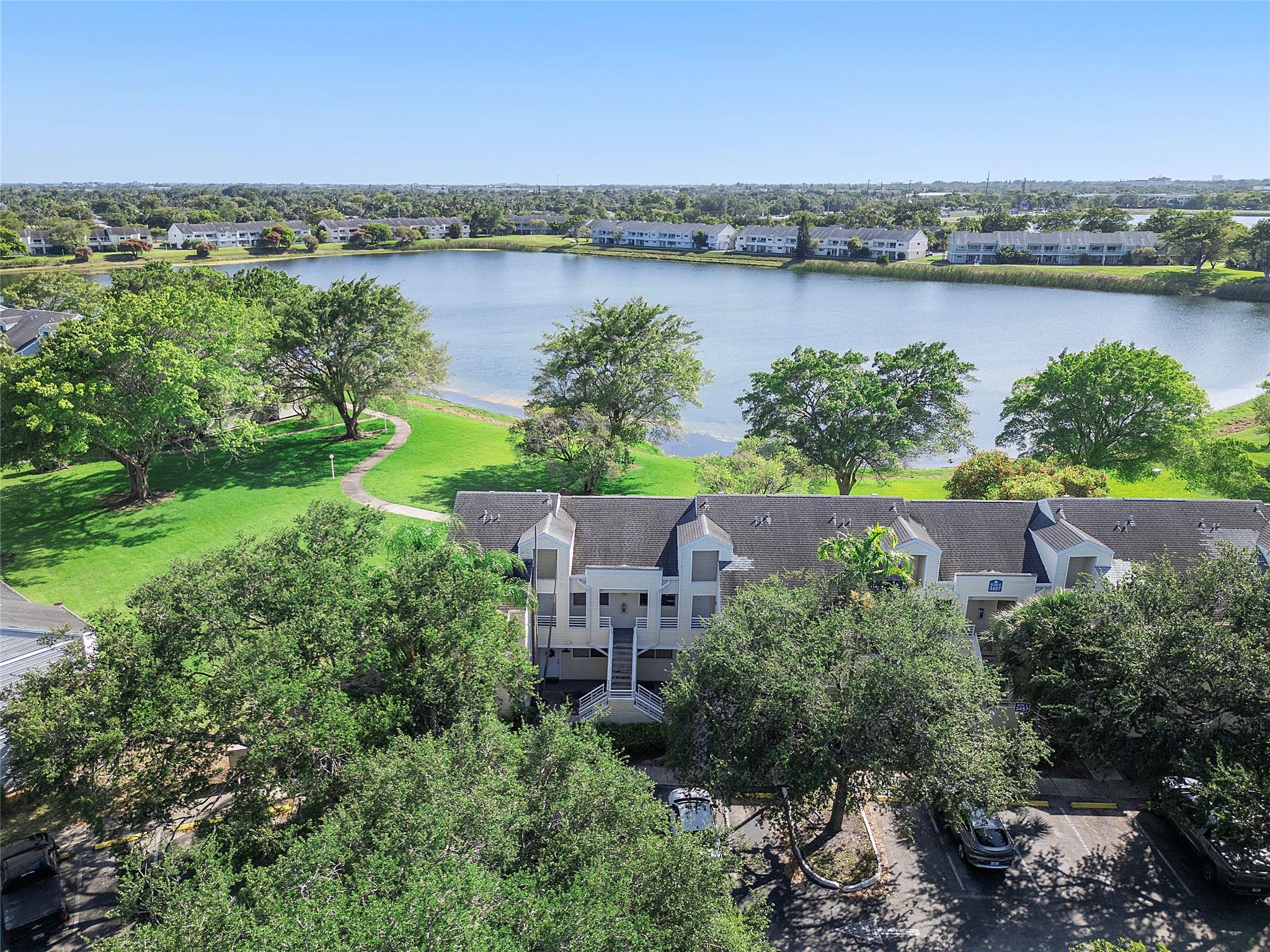 Stunning 2BR/2BA, Spacious, desirable condo in highly sought-after gated Summerlake community with exceptional amenities. Offers breathtaking views of lake. This light-filled 2nd floor unit features soaring cathedral ceilings throughout, large designer white porcelain tile creates an airy, elegant atmosphere. The modern kitchen showcases sleek white paneled cabinetry, warm granite counters. The oversized primary bedroom includes a spacious walk-in closet, private en-suite bath & quartz countertop. The 2nd BR bathed in natural light boasts a custom-built 10-ft wardrobe system with high-gloss white sliding doors, sensor lighting, specialized accessory shelving—ideal for maximizing space. This designer condo offers comfort, convenience & perfect location close to shops, restaurant & beaches.