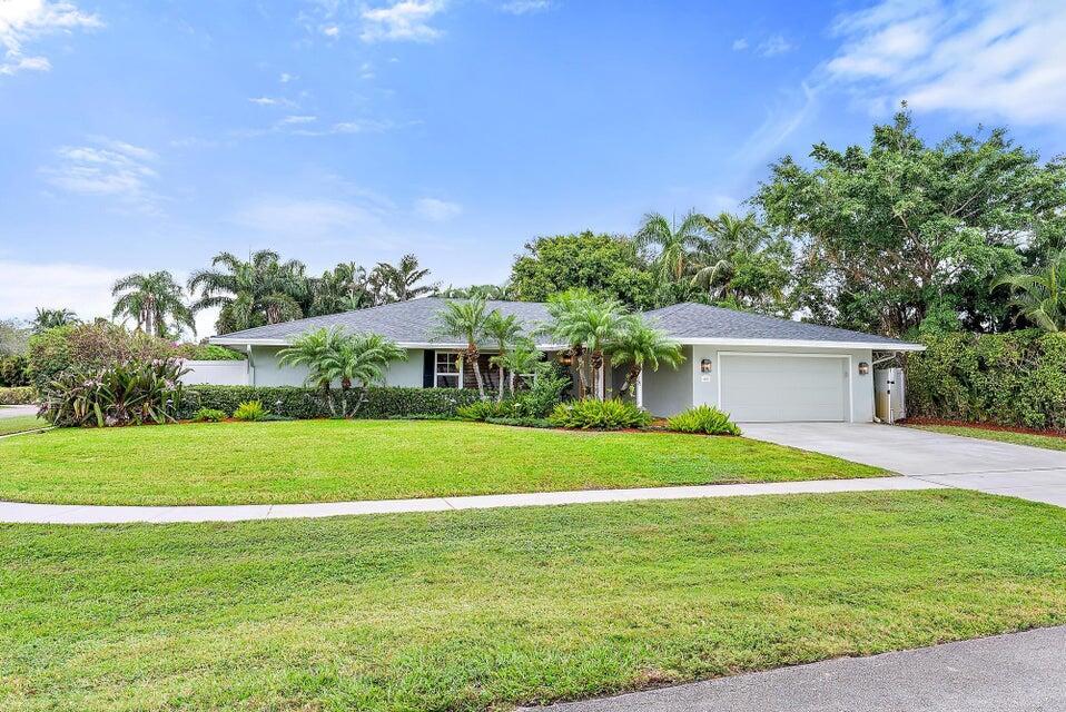 Discover this stunning 3-bedroom, 2-bath home perfectly situated on an oversized, beautifully landscaped corner lot with custom lighting. Located in a family-friendly neighborhood and zoned for highly sought-after A-rated Jupiter schools, this property offers the perfect blend of comfort and convenience--without the restrictions of an HOA.With 2,236 sq. ft. under air and 3,100 sq. ft. total, including an expansive covered patio, there's plenty of space to relax and entertain.