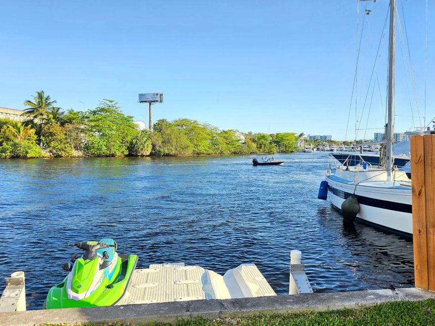 Fully renovated 3-bed, 2-bath waterfront home with direct ocean access and no fixed bridges. Updated in 2021 with impact windows and doors, newer roof, tankless water heater, and upgraded electrical and plumbing. Bright, open layout with high-end tile flooring, recessed lighting, and a modern kitchen featuring quartz countertops, soft-close shaker cabinets, stainless steel appliances, and island storage. Both bathrooms offer sleek, contemporary finishes with frameless glass showers. Enjoy a peaceful backyard overlooking a wide canal that adds a unique sense of openness. Move-in ready and ideal for enjoying the South Florida waterfront lifestyle.