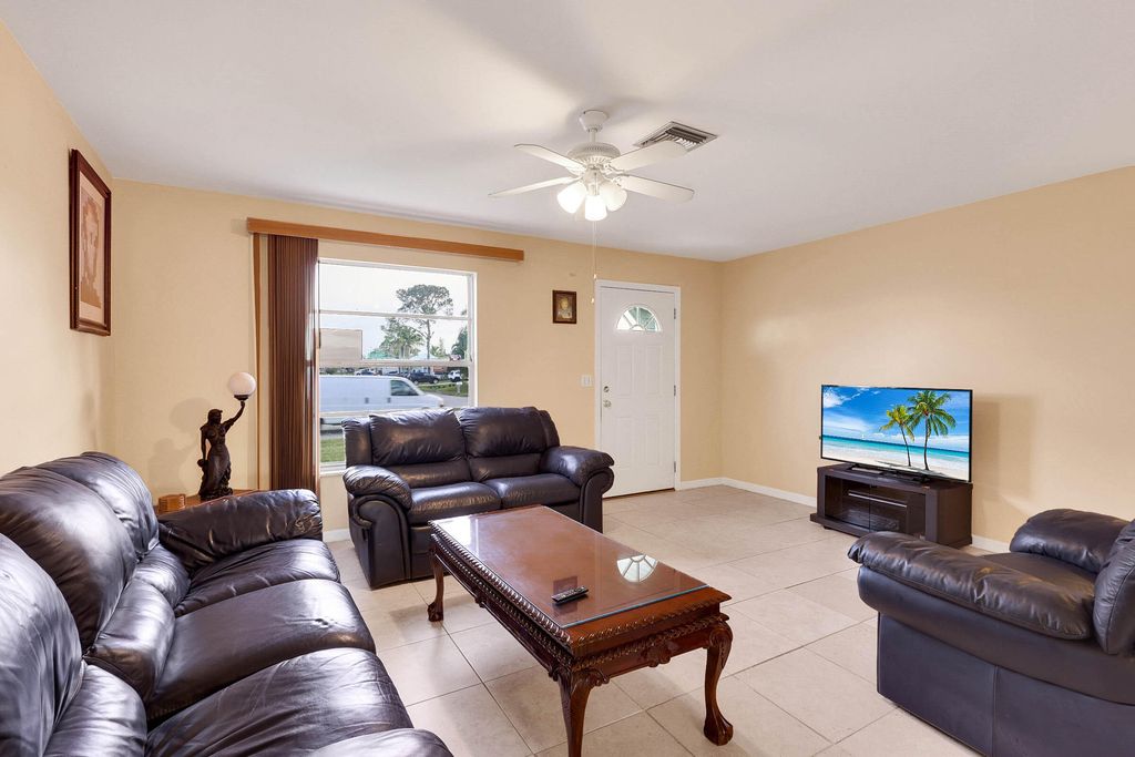 Photo of 113 SW Starfish Avenue, Port Saint Lucie, FL 34984 (MLS # R11118506)