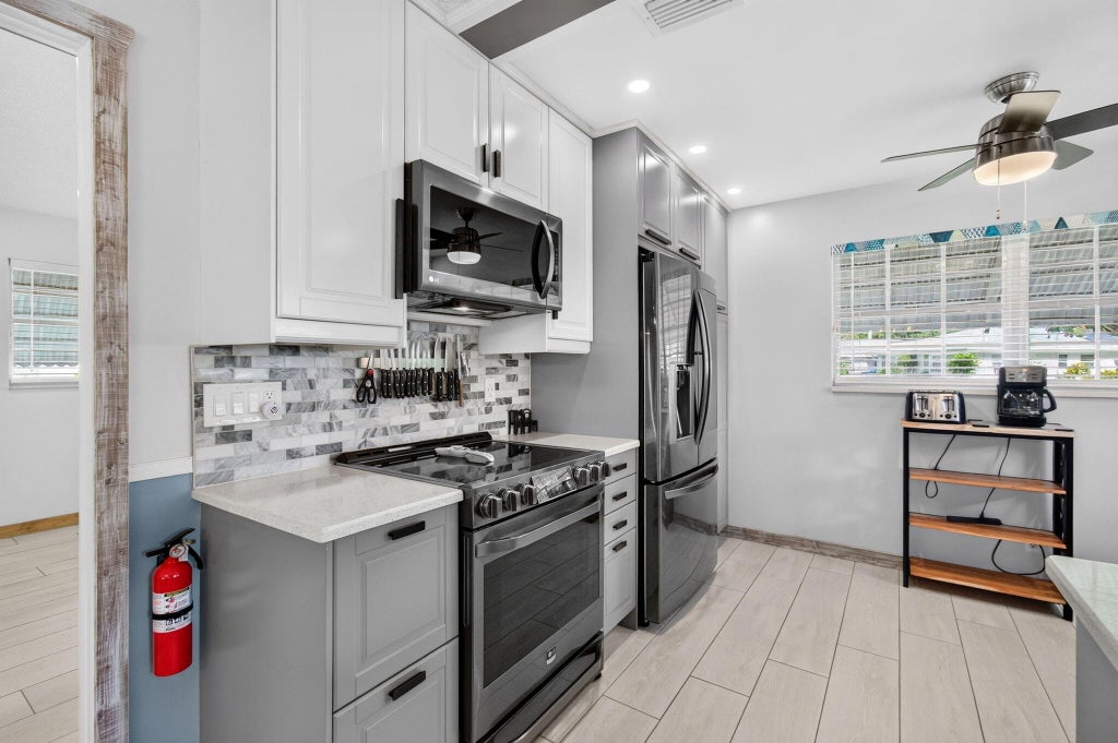 Photo of 812 Meadowlark Lane, Delray Beach, FL 33445 (MLS # B26084761)