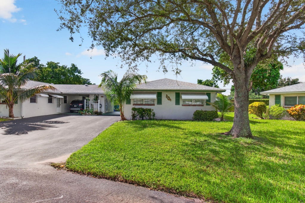Photo of 812 Meadowlark Lane, Delray Beach, FL 33445 (MLS # B26084761)