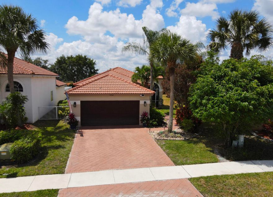 A beautiful, bright, move in condition home in the Grand Isles! Relax on the spacious back patio while enjoying the jacuzzi, perfect for entertaining or enjoy the views from the lovely screened in front patio.  AC is 2017, inside unit is Dec. 23' & hot water heater installed in 2023, all newer appliances!  Move in ready  & make it your own! Wonderful eat-in kitchen with granite counters, range hood & wood cabinets opening to the family room with tile &vinyl flooring throughout. All bedrooms have custom closets. If you are looking for move in ready home in the lovely equestrian neighborhood of Wellington,  this is your home.   Great schools and close to everything.