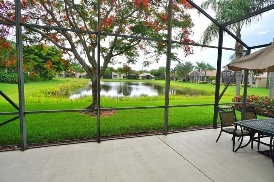 It's all about the Beauty of Florida Living. This South Pacific model offers a large extended breakfast bay window complete with built-in bench seating, the perfect setting for casual dining. A great place to start your day while enjoying your morning coffee. The serene view is incredible from the extended screened- in patio surrounded by mature lush landscaping, overlooking a beautiful lake. Gorgeous bamboo wood floors and faux painted suede finish walls w/contrasting trim and doors create such a warm and inviting ambiance. The Gourmet kitchen is well appointed with wood cabinets, granite countertops, full granite backsplash, wall oven, cooktop and under mount sink. Master Bath has wood cabinets, decorative faucets, upgraded tile and a soaking roman tub with whirlpool jets. Double doors open into the den that makes a great office or guest bedroom. For added convenience owner has installed accordion shutters...enjoy all the great amenities that Valencia Shores is known for. A magnificent 34,000 S.F. Social Club plus a 17,000 S.F.. separate state-of-the-art Athletic Club. Amenities include: Grand ballroom, arts & crafts, billiards room, card rooms, free standing cafe, aerobics studio, a 2400 S.F. fitness center, indoor racquetball courts, indoor hot tub, resort style pool, lap pool, outdoor hot tub, basketball, and a world-class tennis facility.