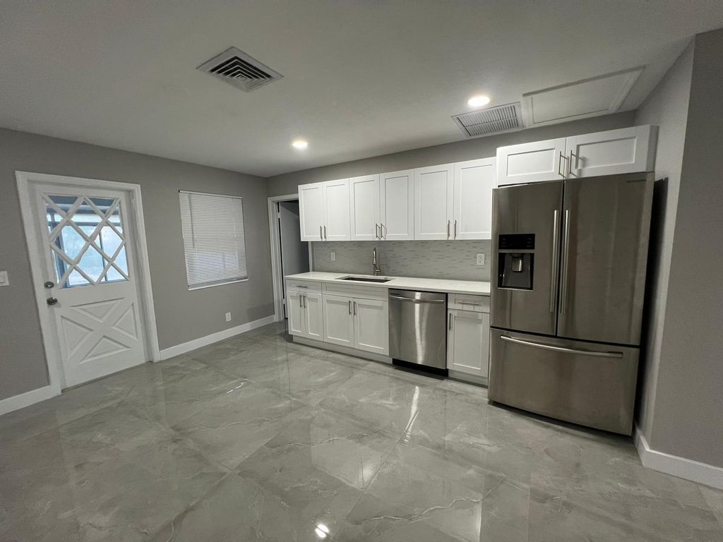 Photo of 129 Euclid Boulevard, Lantana, FL 33462 (MLS # B26027749)