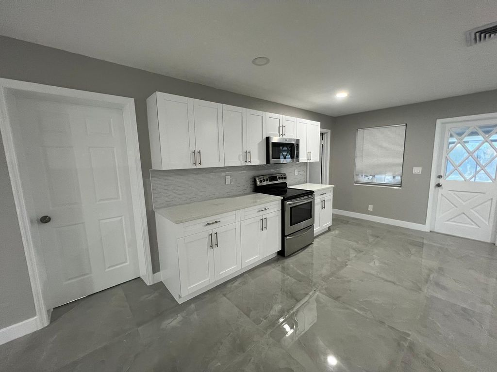 Photo of 129 Euclid Boulevard, Lantana, FL 33462 (MLS # B26027749)